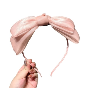 Elegant pink chiffon headband with double-layered large bow for a sweet, stylish look
