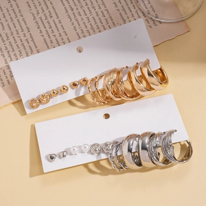 12-piece set of minimalist geometric gold and silver stud earrings in various shapes