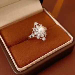 Elegant silver rhombic flower open ring with zircon and pearl in a jewelry box
