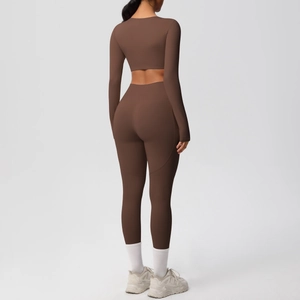 Back view of high-stretch yoga set with U-shaped cutout crop top and leggings