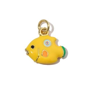 Macro shot of tropical fish enamel pendant in yellow and orange on gold metal base