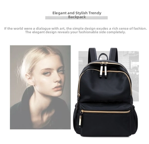 Detail of black waterproof Oxford cloth backpack with golden zippers and side pockets
