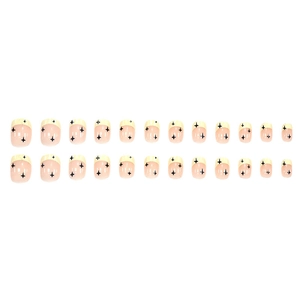 Cute nude pink short press-on nails with yellow French tips and black stars design