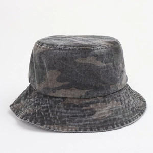 Detail of washed camouflage bucket hat showing vintage denim texture and precise stitching