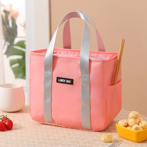 Pink insulated lunch bag for office with waterproof fabric and convenient side pockets