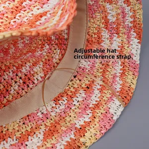 Detail of adjustable inner sweatband and drawstring on multi-color woven straw hat