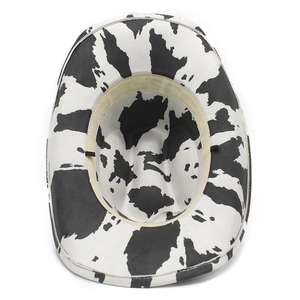 Top view of cow print cowboy hat showing inner beige sweatband and adjustment strings
