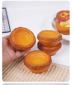 Realistic 7.5cm PU egg tart model showing golden crust texture and smooth tart filling