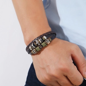 Multilayer leather bracelet with cross charm and beaded stars in bohemian style