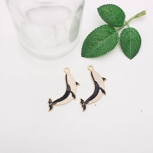 Pair of black and white enamel whale charms made of alloy for DIY jewelry making
