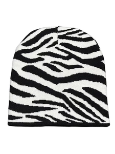Close-up of zebra pattern knitted beanie showing high-density knit texture and monochrome style
