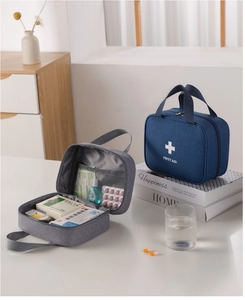 Macro detail of portable first aid kit showing internal mesh pockets and drug storage