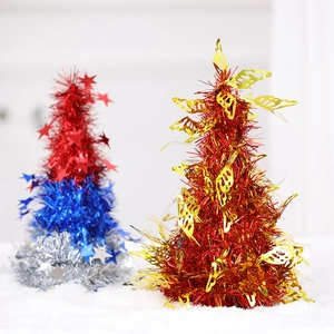 Detailed view of mini festive trees with red, blue, and gold tinsel and star sequins