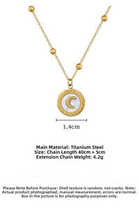 Close-up of gold titanium necklace with hammered shell pendant and moon motif