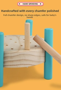 Detail of hand-polished wooden pounding toy with rounded edges and blue cylinder legs