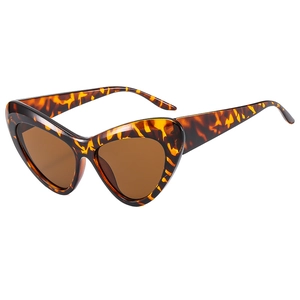 Fashionable leopard print cat-eye sunglasses with tinted lenses on a white background