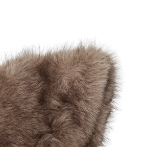Macro detail of plush faux fox fur texture showing soft brown gradient fibers