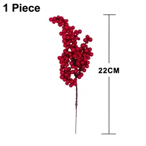 Detail of single 22cm artificial holly red berry stem for festive home decoration