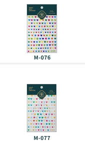 Detailed view of 3D embossed heart nail stickers in rainbow and macaron colors