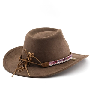 Close-up of brown suede cowboy hat with ethnic woven band and seashell detail