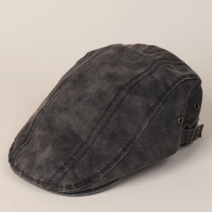 Detail of vintage washed gray newsboy cap featuring side metal vents and adjustable strap