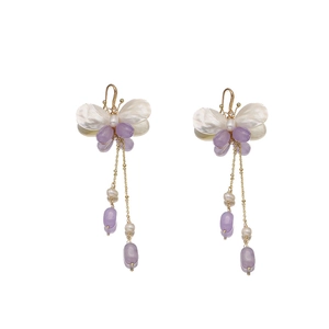 Elegant long butterfly tassel earrings with natural pearls and purple bead accents