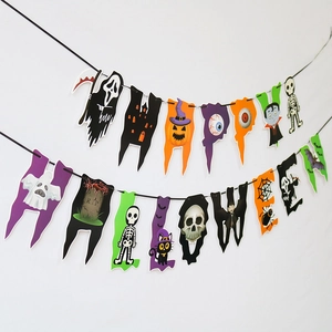 Detail of colorful paper Halloween banner spelling Happy Halloween on a white wall