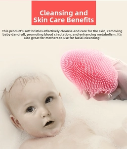 Detail of pink silicone baby bath brush with soft bristles for gentle scalp cleaning