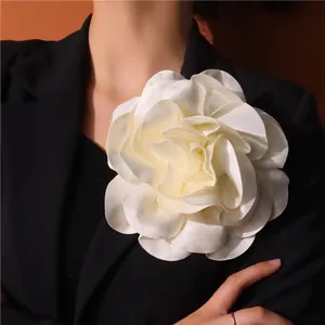 Exaggerated 19cm cream satin fabric flower brooch on black blazer lapel for women