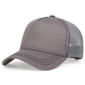 Close-up of dark grey trucker hat showing breathable mesh back and seamless five-panel crown