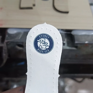 Close-up of white leather insole featuring Sydney Blue Sox mascot logo and blue typography