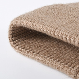 Deep beige ribbed knit beanie made of thick wool blend fabric for winter warmth