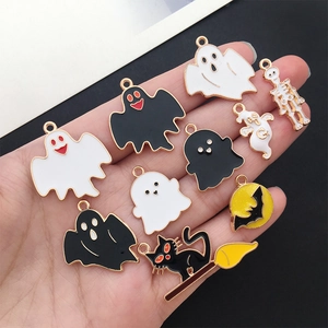 Handheld display of 10 assorted Halloween enamel charms with ghost and bat designs