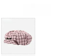 Detailed view of pink plaid denim beret featuring a black silk bow decoration