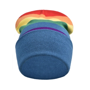 Detailed close-up showing the rainbow knit texture and colorful stripes on a blue beanie
