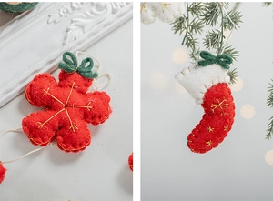 Detail of wool felt Christmas ornaments featuring red snowflake and mini stockings decor