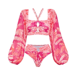 Detail of pink tropical print bikini with chiffon lantern sleeves and gold waist ring