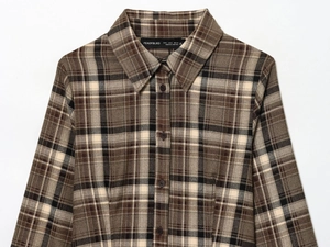 Close-up of the vintage brown plaid shirt collar with detailed woven texture and buttons