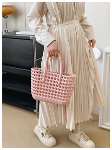 Close-up of the pink hollow woven texture and structure on a large summer jelly tote bag