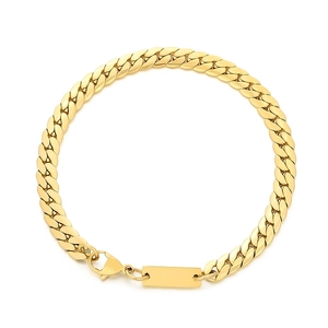 Golden Cuban link bracelet with flat chain links and a polished rectangular ID tag
