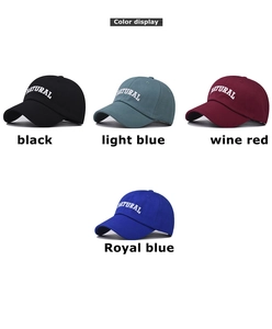 Close-up of NATURAL embroidery and detail of multi-color cotton baseball caps