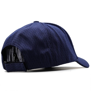 Detail view of navy blue mesh baseball cap showing breathable texture and velcro strap
