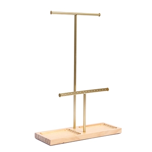 Double-tier gold metal earring stand with natural wooden base for jewelry display