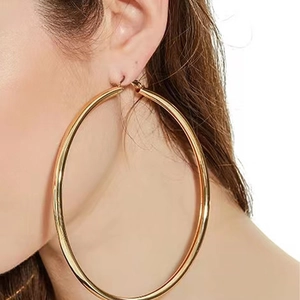 Classic large golden stainless steel hoop earrings for women in trendy chunky style