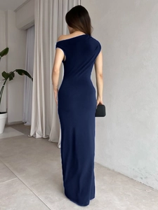 Detail of navy blue ribbed bodycon dress showing back curve and elegant asymmetrical shoulder