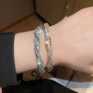 Elegant multi-layer twisted bracelet with sparkling rhinestones in gold and silver finish