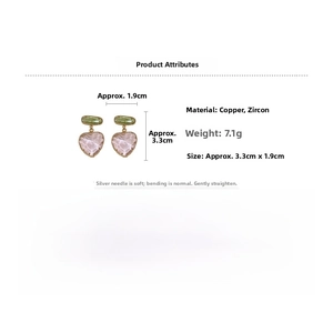 Detail view of heart-shaped earrings featuring pink stone pattern and green zircon