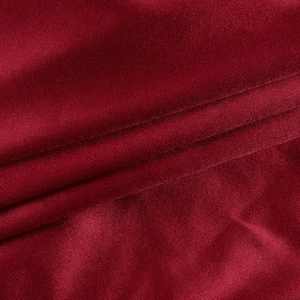 Macro view showing the wine red satin texture and vertical ribbing of the mini dress fabric