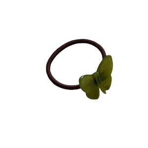 Brown elastic hair tie with green translucent jelly butterfly featuring France Paris text