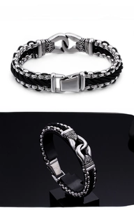 Detail view of double-layer stainless steel bracelet with black braided rope and buckle
